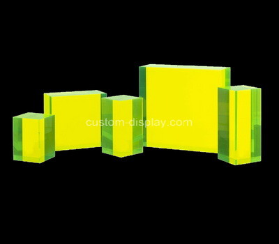 Laser cutting neon yellow acrylic blocks